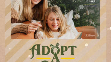 Adopt a family or individual this Christmas. Photo of mother and daughter by Christmas tree.